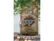 Elegant water fountain with brick surround and climbing vines, creating a serene garden feature at 38 State St # 2, Charleston, SC 29401