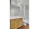 Bathroom featuring light wood-look flooring, a bathtub, and a mirror at 402 Andrea Ln, Hanahan, SC 29410