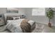 Inviting bedroom with a comfortable bed, accent pillows, and natural light from the window at 402 Andrea Ln, Hanahan, SC 29410