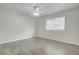 Bright bedroom featuring a ceiling fan and modern vinyl plank flooring, illuminated by natural light at 402 Andrea Ln, Hanahan, SC 29410
