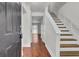 Inviting entryway with wood-look flooring and stairway leading to a bright living space at 402 Andrea Ln, Hanahan, SC 29410