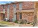 Brick apartment showcasing attractive facade, updated exterior, and well-maintained landscaping at 402 Andrea Ln, Hanahan, SC 29410