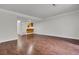 An expansive open concept living room with hardwood floors, bright neutral paint, and recessed lighting at 402 Andrea Ln, Hanahan, SC 29410