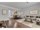 Inviting living room featuring modern decor, hardwood floors, and an open concept design at 402 Andrea Ln, Hanahan, SC 29410