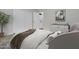 Cozy main bedroom with a laundry room, decorated with neutral colors and soft textures at 402 Andrea Ln, Hanahan, SC 29410