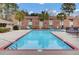 Community pool with clear blue water offers residents a refreshing and relaxing outdoor amenity at 402 Andrea Ln, Hanahan, SC 29410
