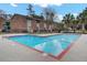 Community pool with a diving board and playground in a well-maintained recreation area at 402 Andrea Ln, Hanahan, SC 29410