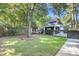 Private backyard featuring a shed, lush green lawn, and a perfect spot for a hammock at 4057 E Amy Ln, Johns Island, SC 29455