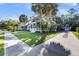 Charming two-story home with lush landscaping, a long driveway, and a well-manicured lawn at 4057 E Amy Ln, Johns Island, SC 29455