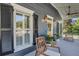 Inviting front porch with rocking chairs, plants, and a view of the neighborhood at 4057 E Amy Ln, Johns Island, SC 29455