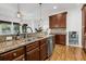 Spacious kitchen featuring granite countertops, stainless steel appliances, and custom wood cabinetry at 4057 E Amy Ln, Johns Island, SC 29455