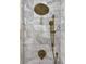 Close-up of a stylish shower featuring a rainfall showerhead and modern fixtures against marble tile at 4057 E Amy Ln, Johns Island, SC 29455