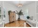 Cozy sitting room featuring a decorative cabinet, plants, hardwood floors, and comfortable seating at 4057 E Amy Ln, Johns Island, SC 29455