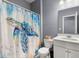 Full bathroom features a turtle themed shower curtain and white vanity at 415 Ribiero Dr, Summerville, SC 29486