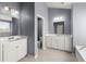 A full bathroom with a double vanity, neutral paint and large mirror at 415 Ribiero Dr, Summerville, SC 29486