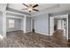 Primary bedroom with a trey ceiling, fan, walk in closet and vinyl plank flooring at 415 Ribiero Dr, Summerville, SC 29486