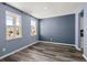 Bright bedroom with large windows, hardwood floors, and neutral paint, creating a cozy and inviting space at 415 Ribiero Dr, Summerville, SC 29486