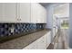 Ample counter space and attractive backsplash add to the kitchen's appeal at 415 Ribiero Dr, Summerville, SC 29486