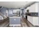 Bright kitchen featuring white cabinets, stainless appliances and hardwood floors at 415 Ribiero Dr, Summerville, SC 29486