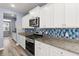 Granite countertops and a stylish backsplash accent the kitchen's modern design at 415 Ribiero Dr, Summerville, SC 29486