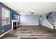 Living room featuring hardwood floors, a fireplace, and a large window at 415 Ribiero Dr, Summerville, SC 29486