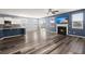 Inviting living room with modern decor, hardwood floors, a fireplace, and a seamless flow to the kitchen at 415 Ribiero Dr, Summerville, SC 29486