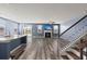 Bright living room with a fireplace, hardwood floors, and a ceiling fan, perfect for relaxation and entertainment at 415 Ribiero Dr, Summerville, SC 29486