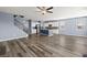 Open-concept living room and kitchen with hardwood floors and stairs to second level at 415 Ribiero Dr, Summerville, SC 29486