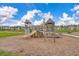 Outdoor playground with slides, climbing structures, and wood chip groundcover in a Gathering-friendly community at 415 Ribiero Dr, Summerville, SC 29486