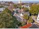 Aerial view of a neighborhood showcasing mature trees and diverse architecture at 42 Barre St, Charleston, SC 29401