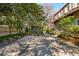 Private backyard featuring brick patio and lush greenery at 42 Barre St, Charleston, SC 29401