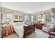 Bright bedroom with large windows, wooden furniture, and classic decor at 42 Barre St, Charleston, SC 29401