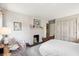 Bedroom with a fireplace and neutral color scheme at 42 Barre St, Charleston, SC 29401