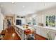 Spacious kitchen boasts a center island, custom cabinetry, and top-of-the-line black appliances at 42 Barre St, Charleston, SC 29401