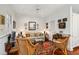 Cozy living room is decorated with unique décor, vintage furniture, and a patterned rug at 42 Barre St, Charleston, SC 29401