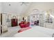 Bright main bedroom with a vaulted ceiling, French doors to balcony, and comfortable seating at 42 Barre St, Charleston, SC 29401