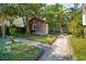 Quaint backyard shed with a window box and stepping stone path at 42 Barre St, Charleston, SC 29401