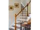 Classic staircase featuring wood railings and white spindles, adding to the home's character at 42 Barre St, Charleston, SC 29401