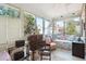 Bright sunroom with large windows, comfortable seating, and vintage furniture at 42 Barre St, Charleston, SC 29401
