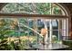 Window showcasing beautiful green foliage and a view of an exterior building and lush landscaping at 42 Barre St, Charleston, SC 29401