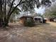 Exterior view of a brick home, highlighting its well-kept lawn and surrounding trees at 4451 Donwood Dr, Ladson, SC 29456
