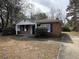 Charming single-story brick home with a well-maintained front yard and classic curb appeal at 4451 Donwood Dr, Ladson, SC 29456