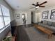 Spacious living room with hardwood floors, comfortable seating, and a modern entertainment setup at 4451 Donwood Dr, Ladson, SC 29456