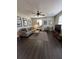 Bright living room featuring hardwood floors, modern furniture, and natural light from the windows at 4451 Donwood Dr, Ladson, SC 29456