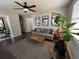 Open living area showcases modern decor, dark hardwood floors, and ample natural light at 4451 Donwood Dr, Ladson, SC 29456