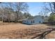 Fenced-in backyard with leafless trees and blue siding home at 4788 Porter Dr, North Charleston, SC 29420