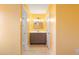 Well-lit bathroom with a large vanity and a shower behind a glass door at 4788 Porter Dr, North Charleston, SC 29420