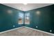 Inviting bedroom with a large window and neutral carpeting at 4788 Porter Dr, North Charleston, SC 29420