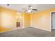 Spacious bedroom with neutral carpet, ceiling fan, and attached bathroom at 4788 Porter Dr, North Charleston, SC 29420