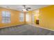 Spacious bedroom with large windows and ceiling fan, leading to the ensuite bathroom at 4788 Porter Dr, North Charleston, SC 29420